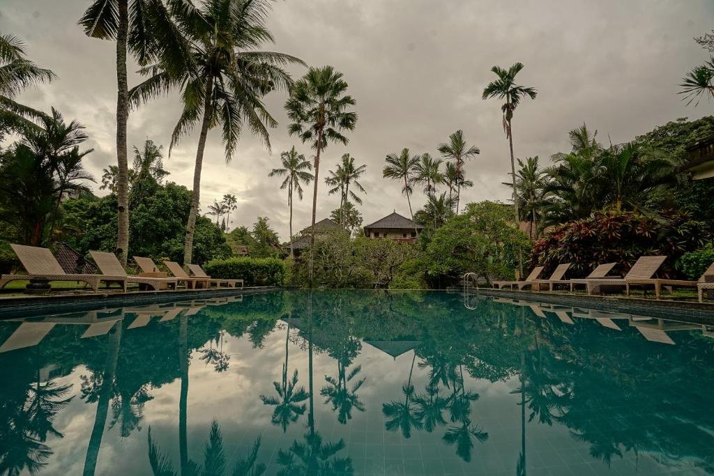 Large tropical swimming pool surrounded by gardens at Pertiwi Resort and Spa Ubud