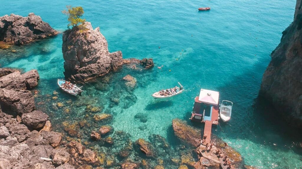 Secluded Paradise Beach in Corfu with white cliffs and turquoise water