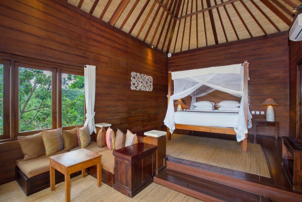 Cozy wooden guest room with balcony at Tegal Sari Accommodation Ubud