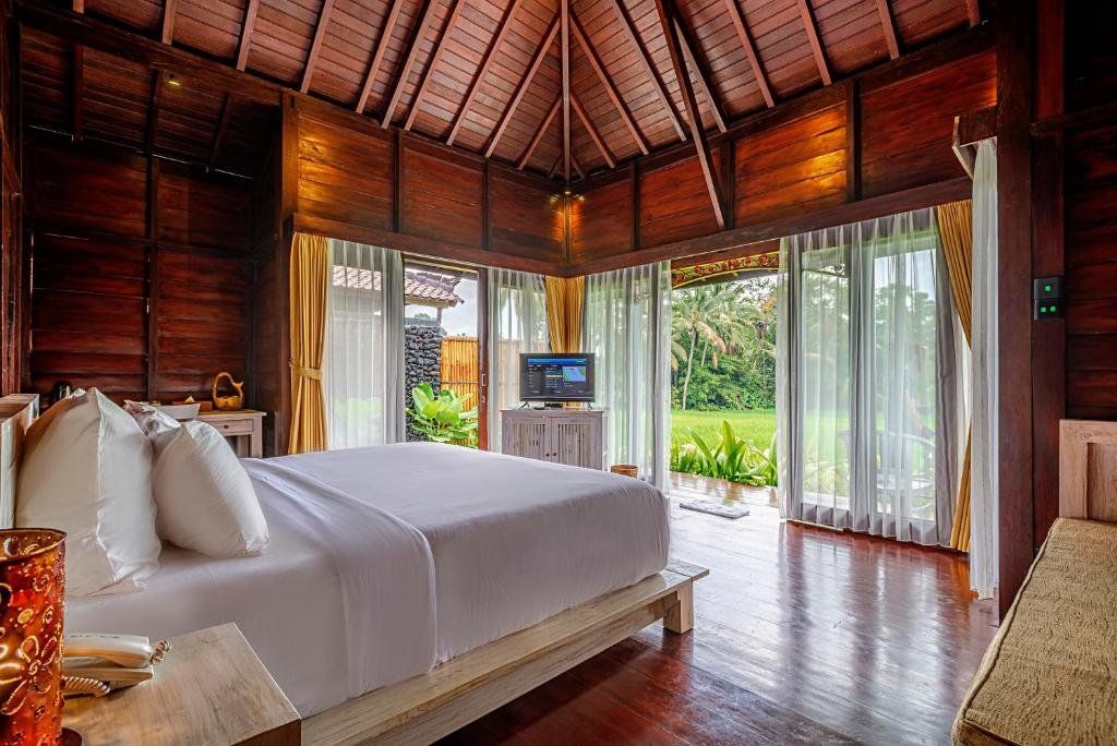 Cozy villa bedroom with natural light and jungle views in Ubud