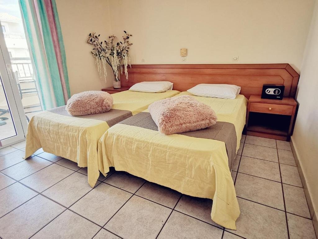 Simple hotel room interior at Sellas Hotel Corfu
