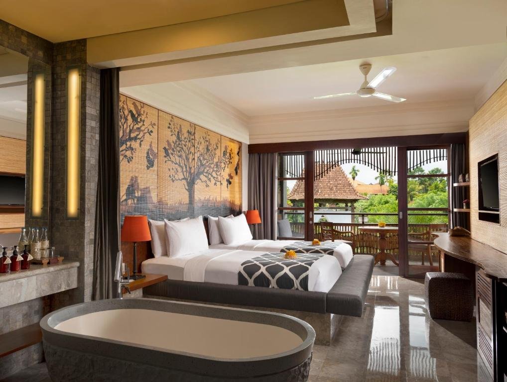 Modern luxury bedroom with garden balcony at Alaya Resort Ubu