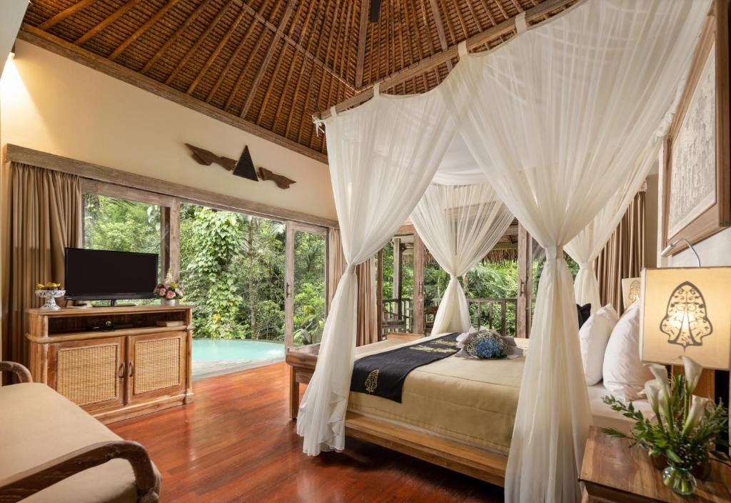 Sunset over tropical rainforest seen from luxury resort terrace