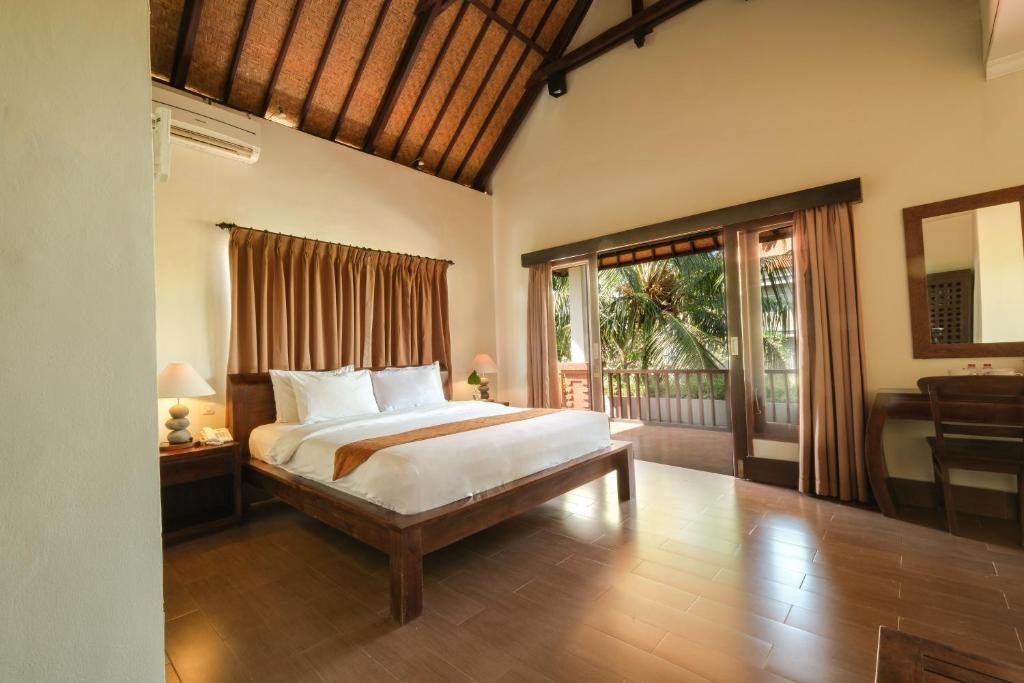 Hotel room balcony overlooking pool Ubud Bali