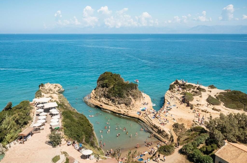 Best Hotels in Sidari beach coastline in Corfu with clear blue water and sandy shore