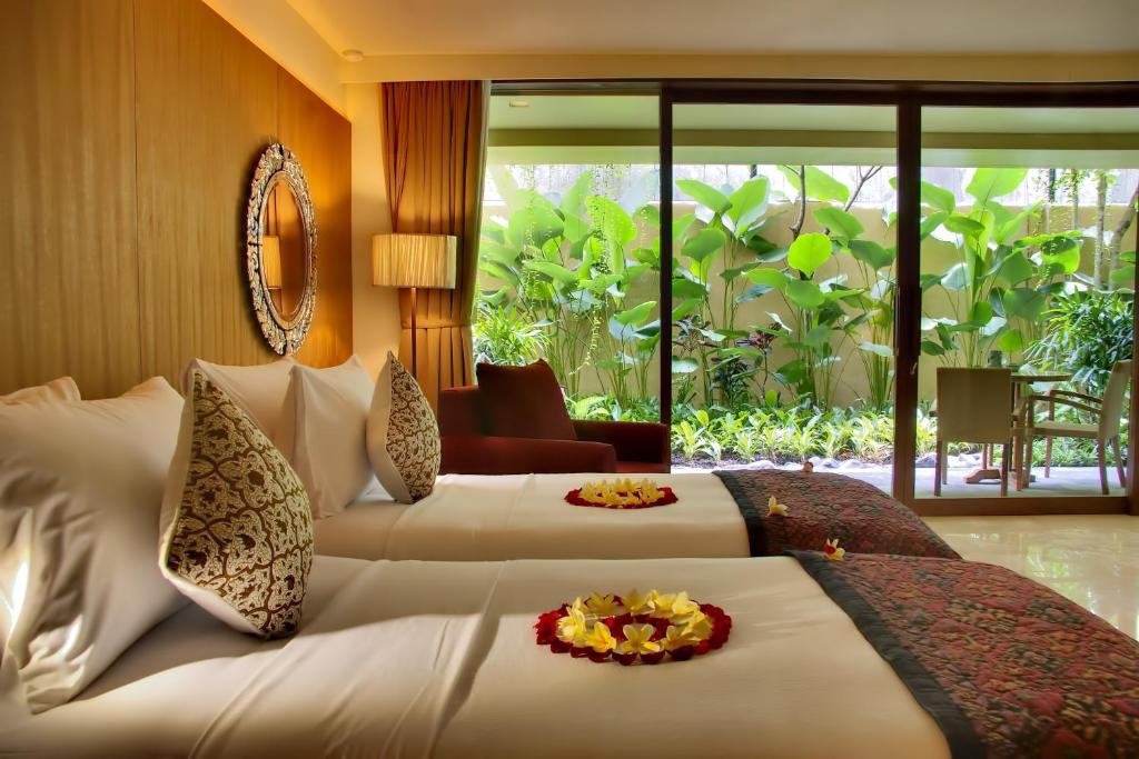 Private rooftop villa terrace overlooking tropical gardens at Komaneka at Rasa Sayang