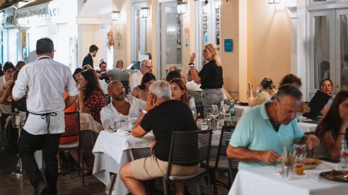 Traditional Greek restaurant interior in Corfu Town with classic décor and served local dishes.