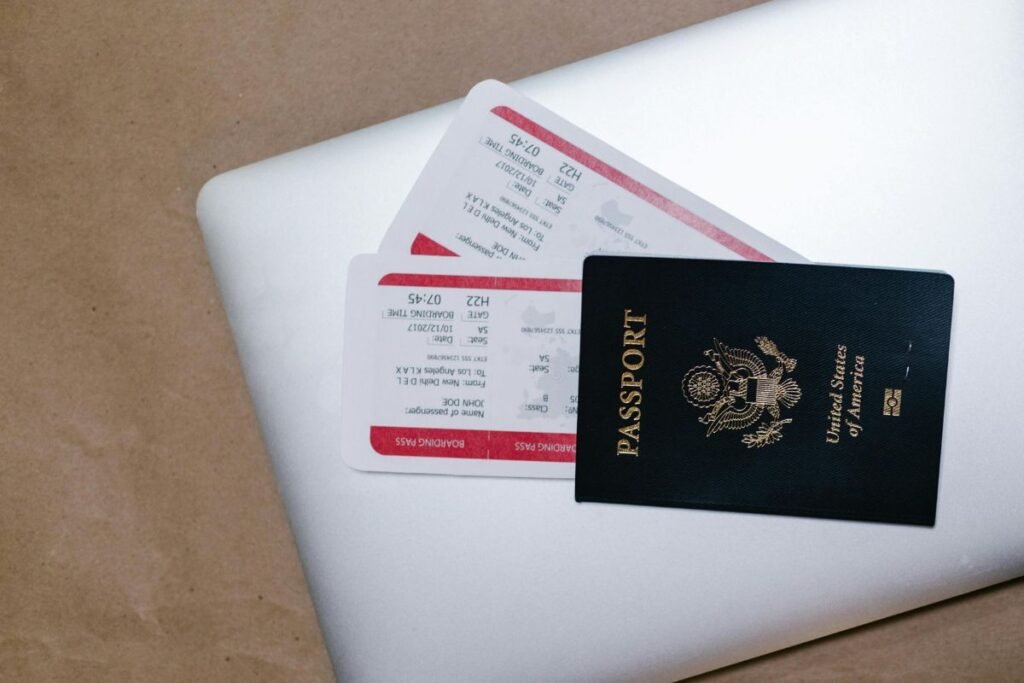 Passport and boarding pass placed on desk during travel planning