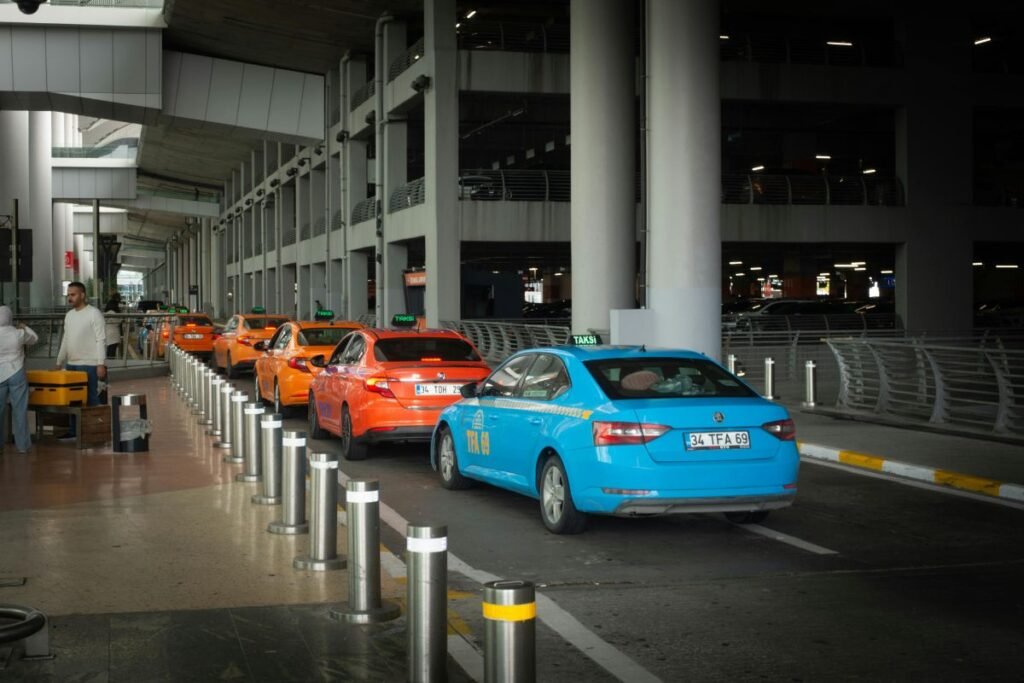 Taxi queue outside Bali airport with arriving passengers