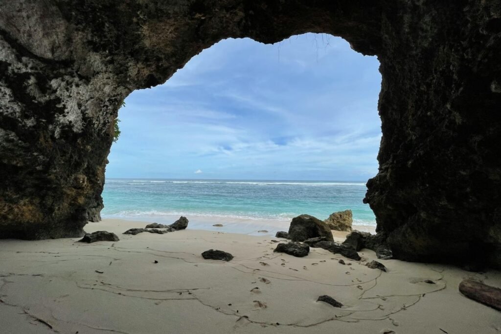 Gunung Payung Beach hidden beach below limestone cliffs