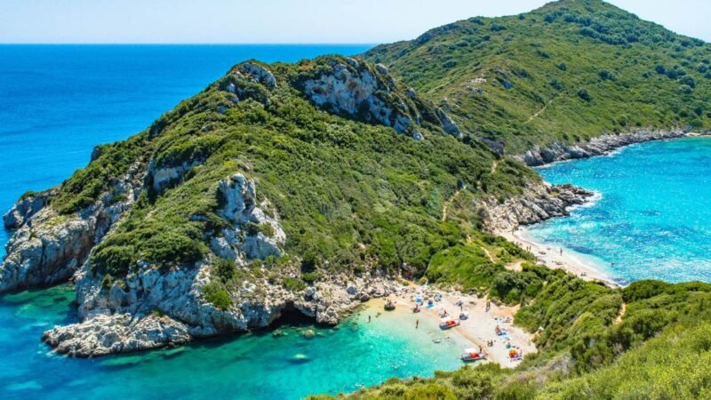 Aerial view of Corfu coastline with turquoise sea and hidden beaches in Greece