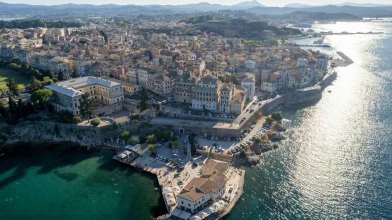 Corfu Town skyline with historic Venetian architecture, colorful buildings, and views of the Ionian Sea in Greece
