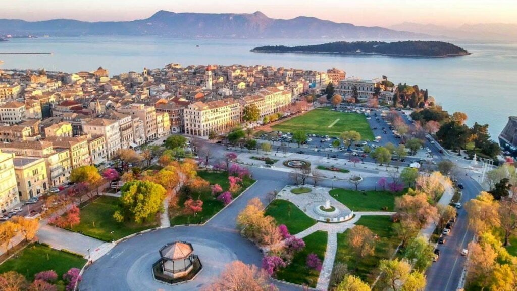 Spianada Square in Corfu Town with green lawns and historic buildings