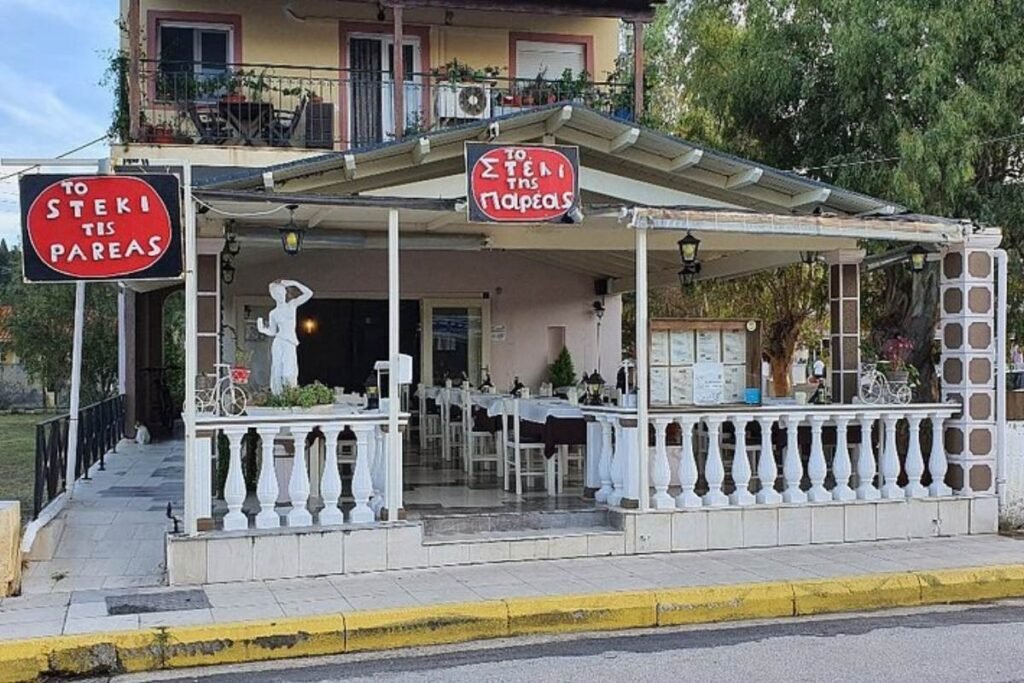 Exterior of To Steki tis Pareas restaurant during the day in Sidari Corfu