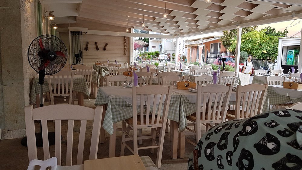 Comfortable interior seating area at Taverna Levanda in Kassiopi with traditional Greek décor and dining tables.