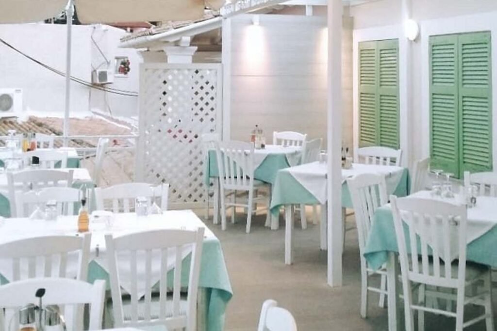 Elegant dining area inside Petrino Restaurant Kassiopi