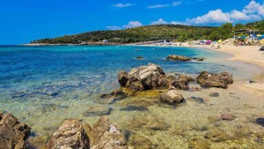 Thassos Greece coastline with crystal-clear turquoise sea and lush green hills