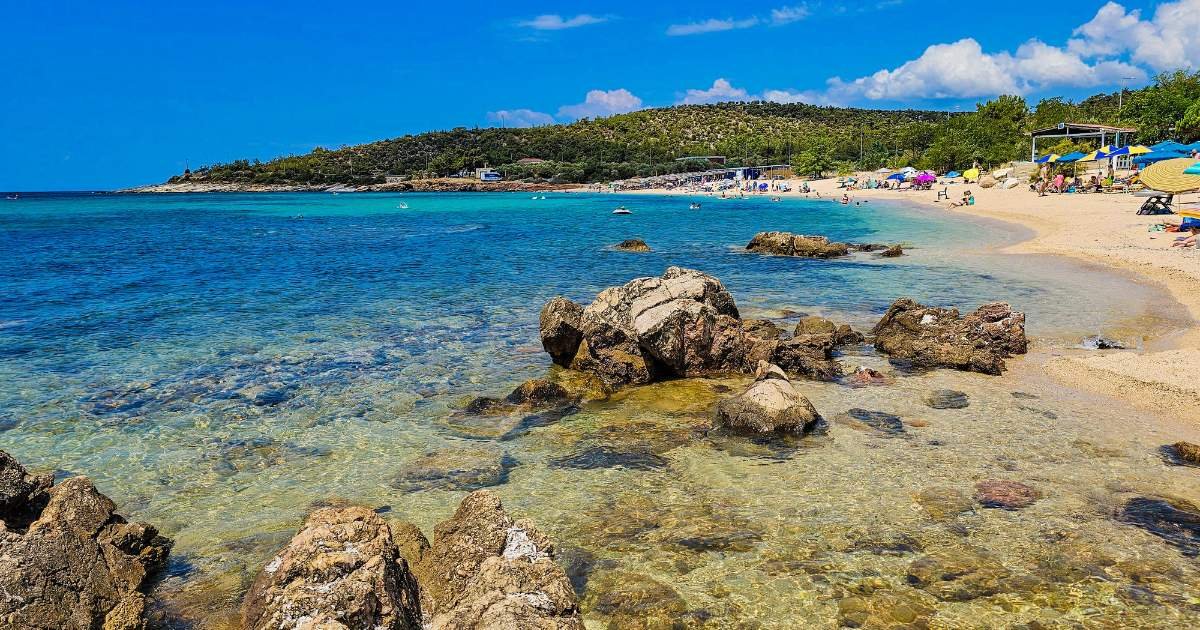 Thassos Greece coastline with crystal-clear turquoise sea and lush green hills