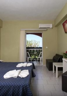 Comfortable hotel room interior at Panorama Sidari Hotel Corfu with bed and balcony