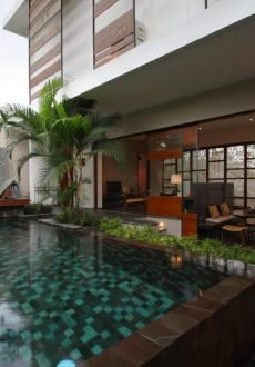 Infinity pool overlooking lush tropical landscape at Tegal Sari Ubud