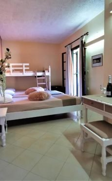Family room with four beds at Sellas Hotel Sidari Corfu simple interior