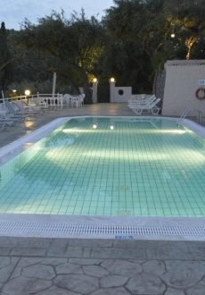 Swimming pool surrounded by olive trees at Odysseus Hotel