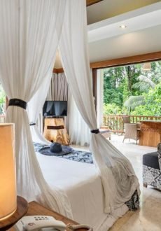 Luxury villa bedroom with wooden interior design at KajaNe Mua Ubud