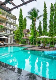 Sunlit outdoor swimming pool at KajaNe Mua Private Villa and Mansion