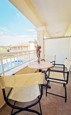 Hotel room balcony at Sellas Hotel Sidari Corfu overlooking pool and garden