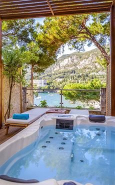 Luxury hotel room with private jacuzzi at Akrotiri Beach Resort Hotel