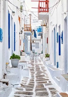 Mykonos Greece white street with traditional Greek architecture