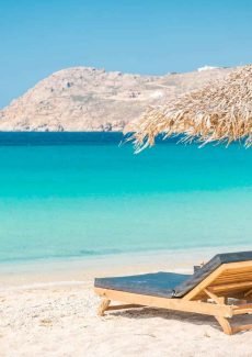 Mykonos Greece beach with sun loungers
