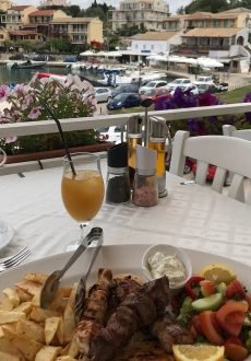 Guests dining on the rooftop terrace at Petrino Restaurant Kassiopi